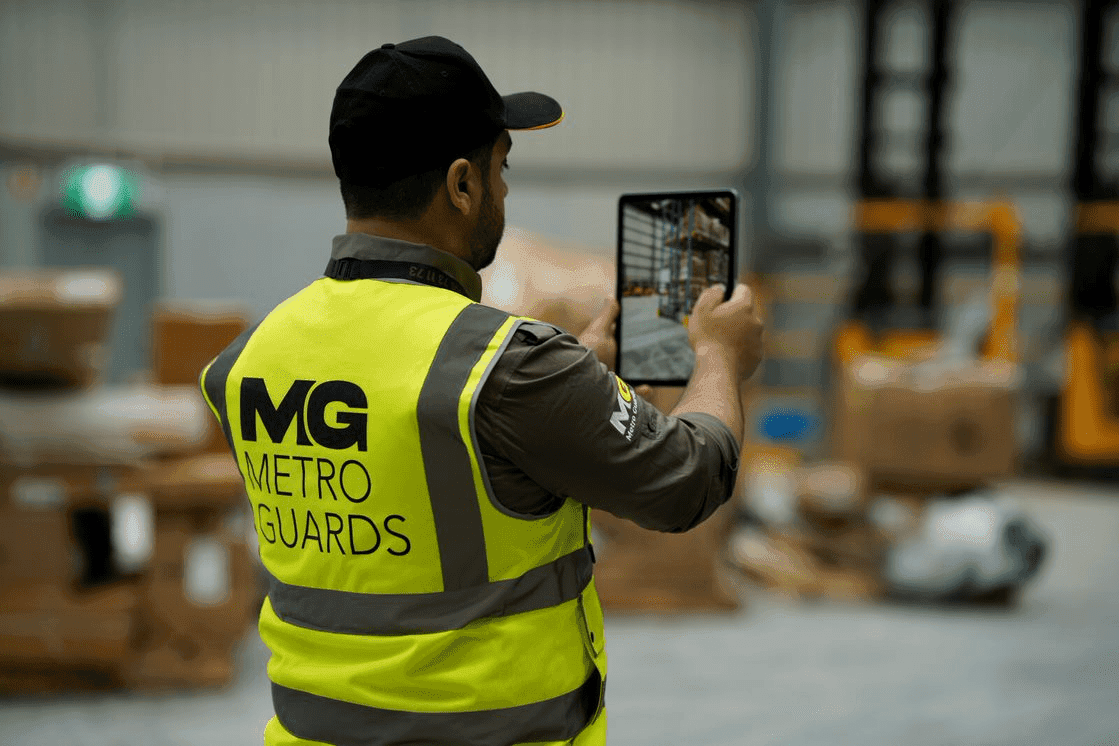 MGS Security technician reviewing live CCTV footage on a tablet